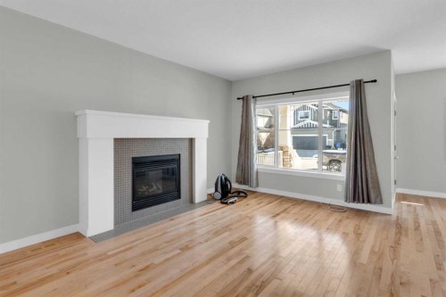 24 Royal Birch Park Nw, Calgary, AB - Indoor Photo Showing Living Room With Fireplace