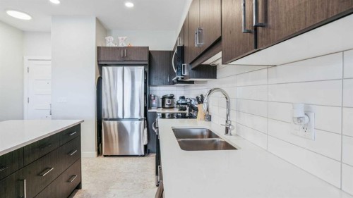 404-125 Wolf Hollow Crescent Se, Calgary, AB - Indoor Photo Showing Kitchen With Double Sink With Upgraded Kitchen