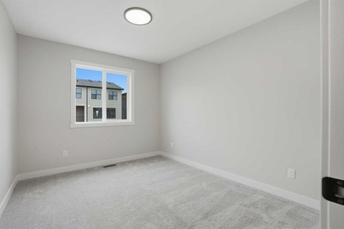 72 Buffaloberry Manor Se, Calgary, AB - Indoor Photo Showing Other Room