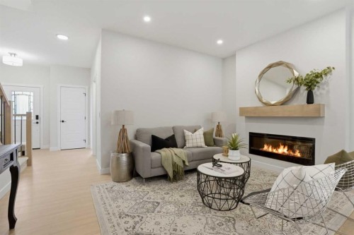 72 Buffaloberry Manor Se, Calgary, AB - Indoor Photo Showing Living Room With Fireplace