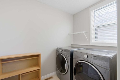 1456 Livingston Way Ne, Calgary, AB - Indoor Photo Showing Laundry Room