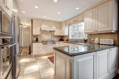 103 Pump Hill Place Sw, Calgary, AB - Indoor Photo Showing Kitchen With Upgraded Kitchen