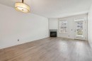 106-3650 Marda Link Sw, Calgary, AB  - Indoor With Fireplace 