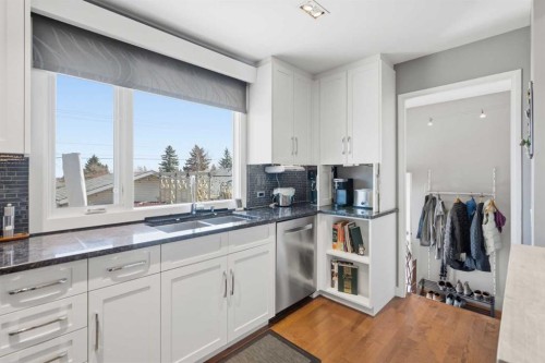 948 Canaveral Crescent Sw, Calgary, AB - Indoor Photo Showing Kitchen With Double Sink