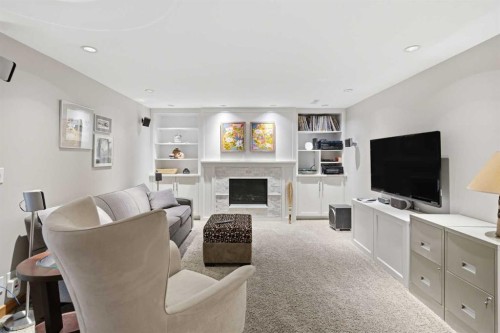 948 Canaveral Crescent Sw, Calgary, AB - Indoor Photo Showing Living Room With Fireplace