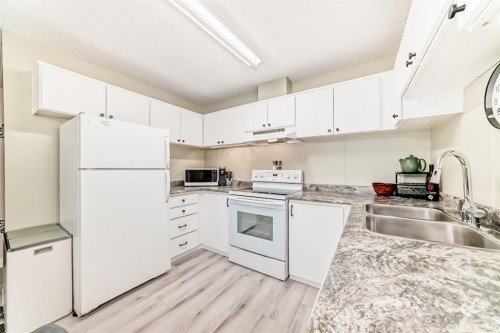 2-6503 Ranchview Drive Nw, Calgary, AB - Indoor Photo Showing Kitchen With Double Sink