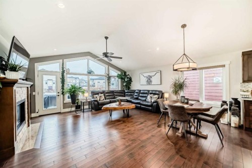 3 Cimarron Springs Circle, Okotoks, AB - Indoor Photo Showing Dining Room With Fireplace