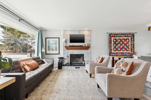 4819 30 Avenue Sw, Calgary, AB - Indoor Photo Showing Living Room With Fireplace