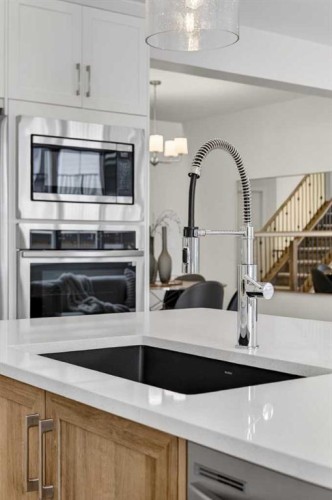67 Versant Way Sw, Calgary, AB - Indoor Photo Showing Kitchen With Double Sink