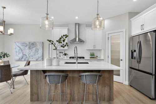 67 Versant Way Sw, Calgary, AB - Indoor Photo Showing Kitchen With Stainless Steel Kitchen With Upgraded Kitchen