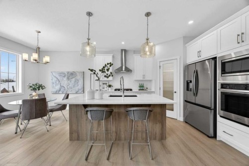 67 Versant Way Sw, Calgary, AB - Indoor Photo Showing Kitchen With Stainless Steel Kitchen With Double Sink With Upgraded Kitchen