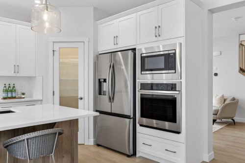 67 Versant Way Sw, Calgary, AB - Indoor Photo Showing Kitchen With Stainless Steel Kitchen