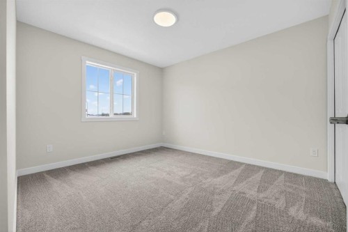 67 Versant Way Sw, Calgary, AB - Indoor Photo Showing Other Room