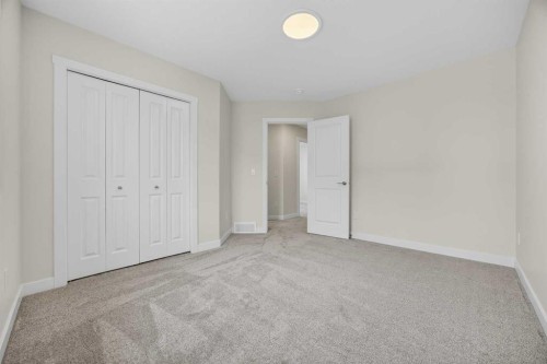67 Versant Way Sw, Calgary, AB - Indoor Photo Showing Other Room
