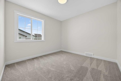 67 Versant Way Sw, Calgary, AB - Indoor Photo Showing Other Room