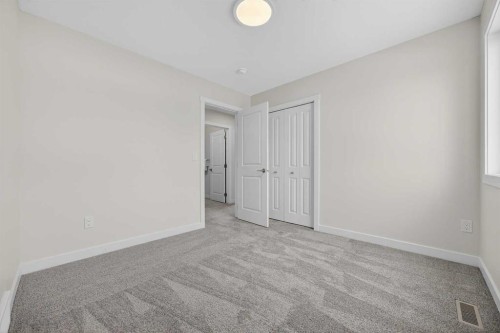 67 Versant Way Sw, Calgary, AB - Indoor Photo Showing Other Room