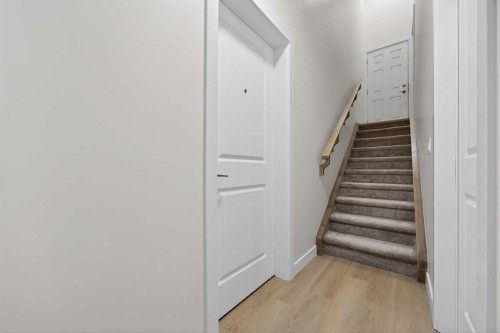 67 Versant Way Sw, Calgary, AB - Indoor Photo Showing Other Room