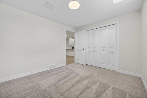 67 Versant Way Sw, Calgary, AB - Indoor Photo Showing Other Room
