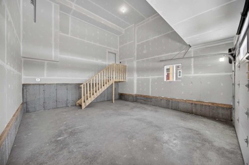 67 Versant Way Sw, Calgary, AB - Indoor Photo Showing Garage