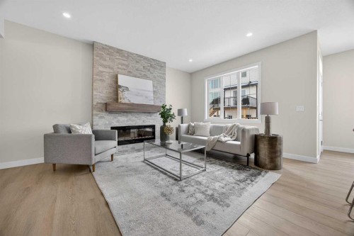 67 Versant Way Sw, Calgary, AB - Indoor Photo Showing Living Room With Fireplace