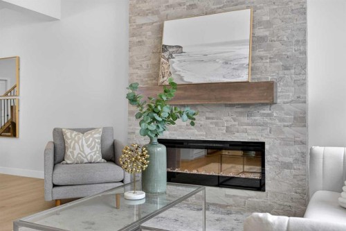 67 Versant Way Sw, Calgary, AB - Indoor Photo Showing Living Room With Fireplace
