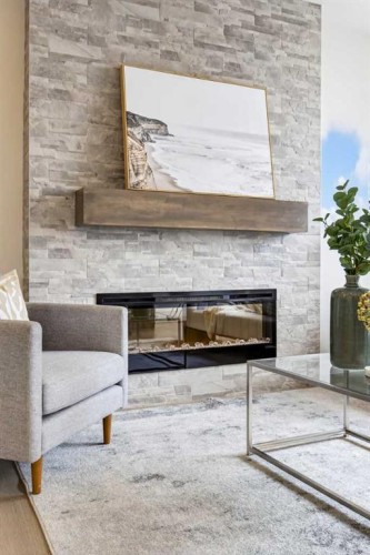 67 Versant Way Sw, Calgary, AB - Indoor Photo Showing Living Room With Fireplace