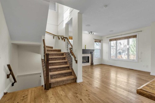 8 Legacy Terrace Se, Calgary, AB - Indoor Photo Showing Other Room With Fireplace