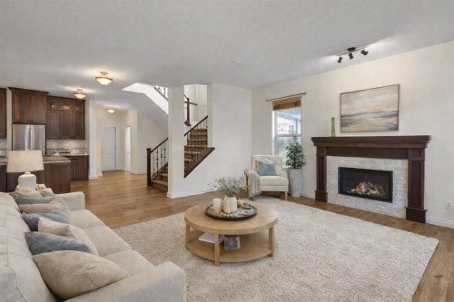 8 Legacy Terrace Se, Calgary, AB - Indoor Photo Showing Living Room With Fireplace