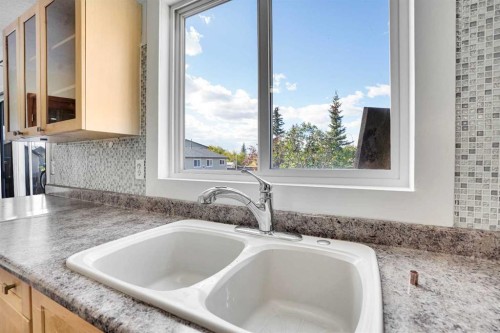 26 Falmead Bay Ne, Calgary, AB - Indoor Photo Showing Kitchen With Double Sink