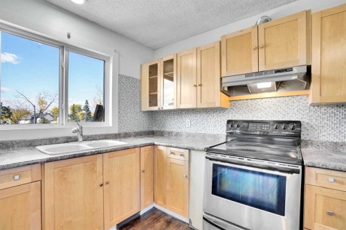 26 Falmead Bay Ne, Calgary, AB - Indoor Photo Showing Kitchen With Double Sink