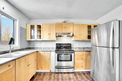 26 Falmead Bay Ne, Calgary, AB - Indoor Photo Showing Kitchen With Double Sink
