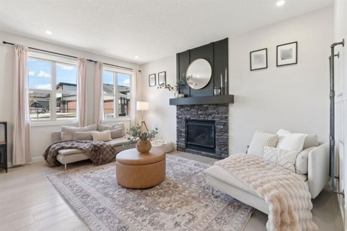 206 Riviera View, Cochrane, AB - Indoor Photo Showing Living Room With Fireplace