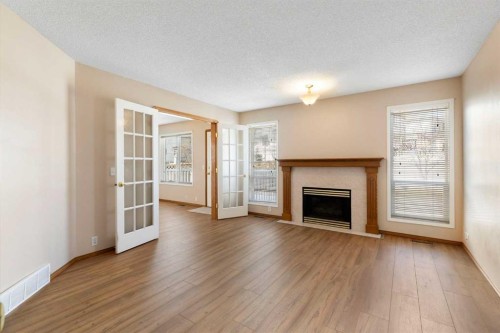 205 Scotia Point Nw, Calgary, AB - Indoor Photo Showing Living Room With Fireplace