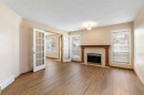 205 Scotia Point Nw, Calgary, AB  - Indoor Photo Showing Living Room With Fireplace 