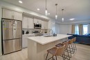 5119-20295 Seton Way Se, Calgary, AB  - Indoor Photo Showing Kitchen With Stainless Steel Kitchen With Double Sink With Upgraded Kitchen 