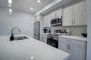 5119-20295 Seton Way Se, Calgary, AB  - Indoor Photo Showing Kitchen With Stainless Steel Kitchen With Double Sink 