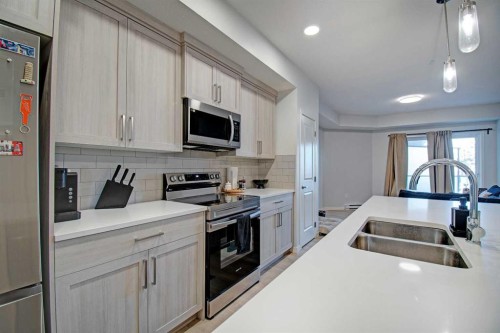 5119-20295 Seton Way Se, Calgary, AB - Indoor Photo Showing Kitchen With Stainless Steel Kitchen With Double Sink With Upgraded Kitchen