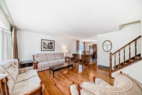 183 Dalcastle Way Nw, Calgary, AB - Indoor Photo Showing Living Room