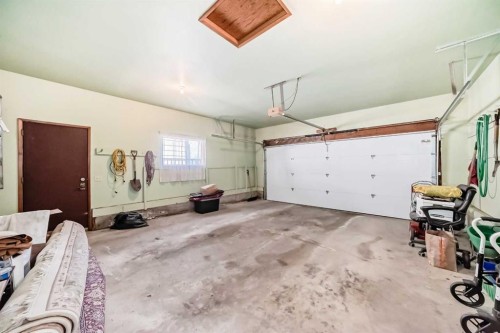 183 Dalcastle Way Nw, Calgary, AB - Indoor Photo Showing Garage