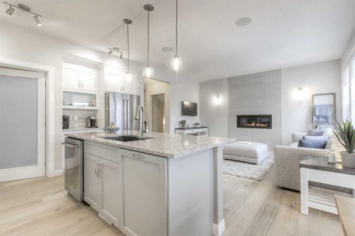 54 Silverado Plains Common Sw, Calgary, AB - Indoor Photo Showing Kitchen With Fireplace With Upgraded Kitchen