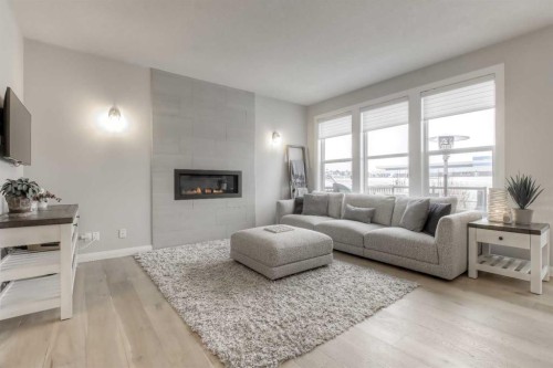 54 Silverado Plains Common Sw, Calgary, AB - Indoor Photo Showing Living Room With Fireplace
