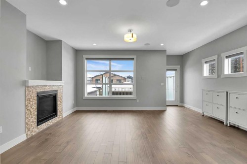 256 25 Avenue Ne, Calgary, AB - Indoor Photo Showing Living Room With Fireplace