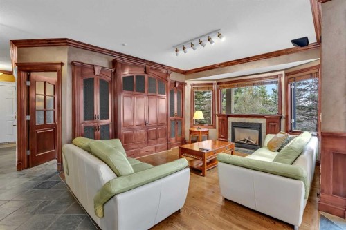 216 Evergreen Heath Sw, Calgary, AB - Indoor Photo Showing Living Room With Fireplace