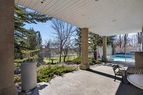 216 Evergreen Heath Sw, Calgary, AB - Outdoor With In Ground Pool