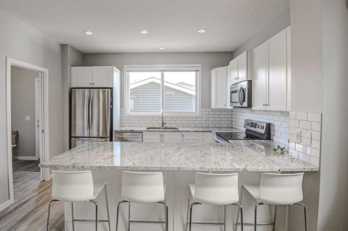52 Masters Link Se, Calgary, AB - Indoor Photo Showing Kitchen With Upgraded Kitchen
