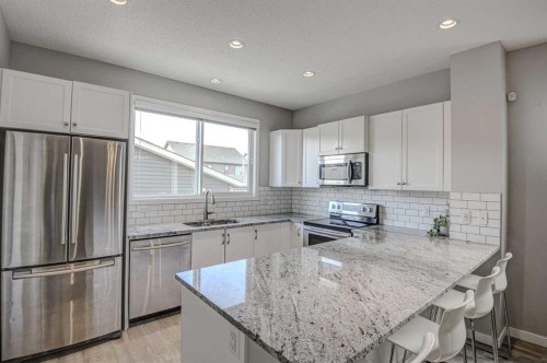 52 Masters Link Se, Calgary, AB - Indoor Photo Showing Kitchen With Upgraded Kitchen