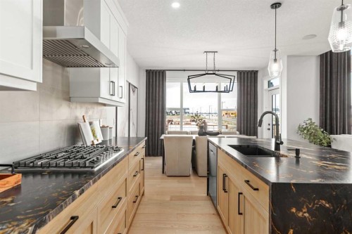 291 Rivercrest Way, Cochrane, AB - Indoor Photo Showing Kitchen With Upgraded Kitchen