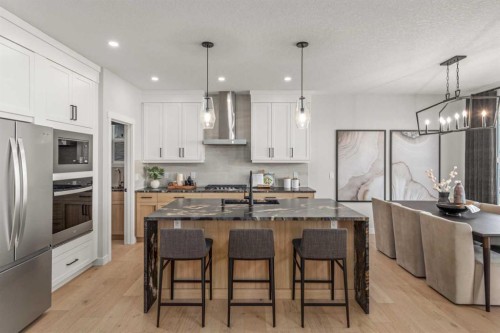 291 Rivercrest Way, Cochrane, AB - Indoor Photo Showing Kitchen With Upgraded Kitchen