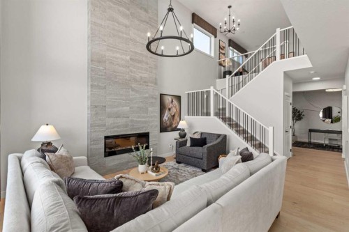 291 Rivercrest Way, Cochrane, AB - Indoor Photo Showing Living Room With Fireplace