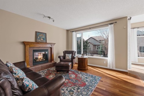 430 Discovery Ridge Boulevard Sw, Calgary, AB - Indoor Photo Showing Living Room With Fireplace
